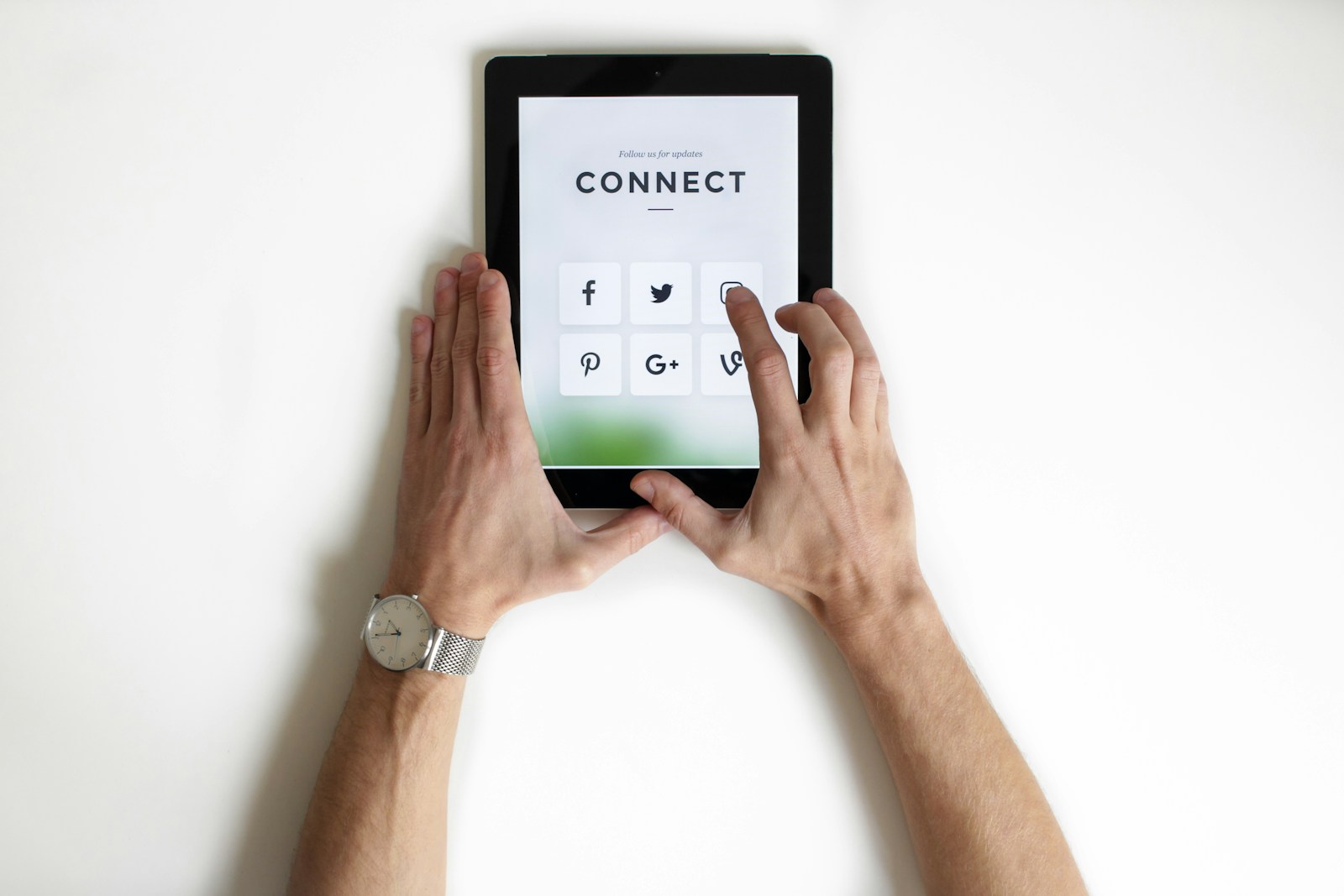 Photo by NordWood Themes person using black iPad